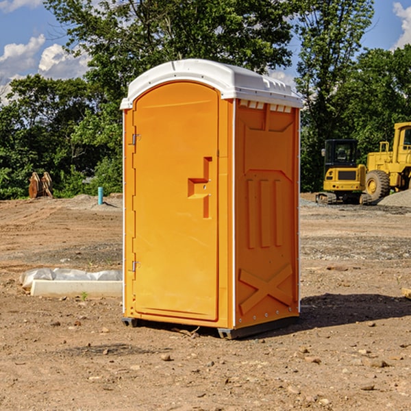 what is the cost difference between standard and deluxe porta potty rentals in Andrew Iowa